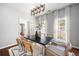 Elegant dining room with modern lighting, stylish decor, and hardwood floors at 384 Wesley Dr, Acworth, GA 30101