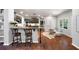 Open-concept living space features hardwood floors, a granite wet bar, and seamless flow at 384 Wesley Dr, Acworth, GA 30101