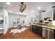 Bright living area with vaulted ceiling, hardwood floors, granite wet bar, and abundant natural light at 384 Wesley Dr, Acworth, GA 30101