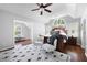 Spacious main bedroom with a vaulted ceiling, carpet, accent chairs, and a comfortable bed at 384 Wesley Dr, Acworth, GA 30101