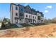 Charming brick townhomes with stylish dark accents, modern windows, and covered entryways offer comfortable, contemporary living at 521 Rubato Knl, Mcdonough, GA 30253