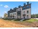 Charming brick townhomes with stylish dark accents and modern windows offer comfortable, contemporary living at 521 Rubato Knl, Mcdonough, GA 30253
