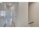 Hallway with neutral paint, light wood-look floors and bright lighting at 521 Rubato Knl, Mcdonough, GA 30253