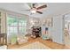 Bright bedroom with window, hardwood floors, and play area at 5566 River Heights Se Xing, Marietta, GA 30067