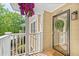 Inviting front porch with hanging flower basket and wreath on the front door of this charming home at 5566 River Heights Se Xing, Marietta, GA 30067