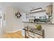 Open kitchen area with a breakfast bar, stainless steel appliances, and hardwood floors at 5566 River Heights Se Xing, Marietta, GA 30067