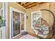 Cozy screened-in porch featuring a hanging chair at 5566 River Heights Se Xing, Marietta, GA 30067
