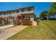 Townhome shows garage, wooden deck and landscaped yard at 6150 Thorncrest Dr, Tucker, GA 30084