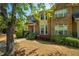 Lovely two-story brick home with a well-maintained lawn and mature trees at 6150 Thorncrest Dr, Tucker, GA 30084