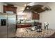Bright kitchen with stainless steel appliances, granite countertops, and an open layout at 6150 Thorncrest Dr, Tucker, GA 30084