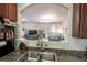Open concept kitchen sink with granite countertops that looks into the adjacent living area at 6150 Thorncrest Dr, Tucker, GA 30084