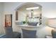 View of a modern kitchen from the dining area, featuring stainless steel appliances at 6150 Thorncrest Dr, Tucker, GA 30084
