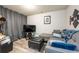 Basement living room features a comfortable seating area, television, and stylish decor at 6150 Thorncrest Dr, Tucker, GA 30084