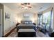 Comfortable main bedroom featuring a ceiling fan, natural light, and ample closet space at 6150 Thorncrest Dr, Tucker, GA 30084