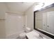 Well-lit bathroom with a shower-tub combo, sleek fixtures, and a vanity for storage and style at 841 Sapphire Ln, Sugar Hill, GA 30518
