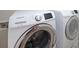 Modern laundry room featuring a new white Samsung washer and dryer set at 841 Sapphire Ln, Sugar Hill, GA 30518