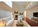 Bright living room with a fireplace, high ceilings, and hardwood floors at 841 Sapphire Ln, Sugar Hill, GA 30518