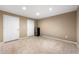 Finished basement with tile flooring and two doors at 1214 Defoors Nw Ct # 1A, Atlanta, GA 30318