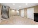 Spacious finished basement with tiled floors and multiple access doors to the exterior at 1214 Defoors Nw Ct # 1A, Atlanta, GA 30318