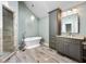 The bright bathroom has a soaking tub and walk-in shower at 1214 Defoors Nw Ct # 1A, Atlanta, GA 30318