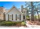 Charming home with a landscaped front yard, featuring a stone accent wall and fresh, neutral paint at 1214 Defoors Nw Ct # 1A, Atlanta, GA 30318