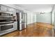 Bright kitchen includes stainless steel appliances, hardwood floors, and open space at 1214 Defoors Nw Ct # 1A, Atlanta, GA 30318
