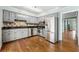 Well-lit kitchen features gray cabinets, stainless steel appliances, and hardwood floors at 1214 Defoors Nw Ct # 1A, Atlanta, GA 30318