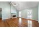 Well-lit living room with hardwood floors, fireplace, and bright, neutral paint at 1214 Defoors Nw Ct # 1A, Atlanta, GA 30318
