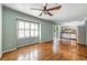 Living room featuring hardwood floors, bright neutral paint, and plantation shutters at 1214 Defoors Nw Ct # 1A, Atlanta, GA 30318