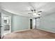 Spacious main bedroom has an ensuite bathroom and ceiling fan at 1214 Defoors Nw Ct # 1A, Atlanta, GA 30318