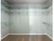 Walk-in closet has white wire shelving on all sides at 1214 Defoors Nw Ct # 1A, Atlanta, GA 30318