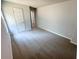 An airy bedroom features a carpeted floor, neutral paint, bright white doors and natural light at 1331 E Atlanta E Rd, Stockbridge, GA 30281