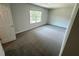 Spacious bedroom featuring gray carpeting and a large window that allows ample natural light at 1331 E Atlanta E Rd, Stockbridge, GA 30281