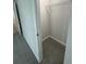 A small closet with a metal rack and carpeted floor, offering simple storage solutions at 1331 E Atlanta E Rd, Stockbridge, GA 30281