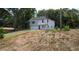 Charming two-story home with a red door, attached garage and freshly cut front lawn at 1331 E Atlanta E Rd, Stockbridge, GA 30281