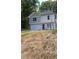 A lovely two-story house with a garage, siding, new roof, and a neat front yard at 1331 E Atlanta E Rd, Stockbridge, GA 30281