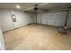 Clean, empty garage with concrete floors and white garage door at 1331 E Atlanta E Rd, Stockbridge, GA 30281