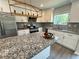 Modern kitchen features granite counters, stainless steel appliances, and a stylish backsplash design at 1331 E Atlanta E Rd, Stockbridge, GA 30281
