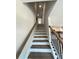 Stairway with wood handrail and black iron balusters leading to the upper level at 1331 E Atlanta E Rd, Stockbridge, GA 30281