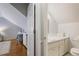 Cozy bathroom featuring a built-in vanity with storage and a toilet at 2567 Hyde Manor Nw Dr, Atlanta, GA 30327