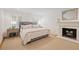 Bedroom featuring neutral decor, a fireplace, and natural light at 2567 Hyde Manor Nw Dr, Atlanta, GA 30327