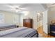 Shared bedroom with two beds, wood floors, and a large dresser at 2567 Hyde Manor Nw Dr, Atlanta, GA 30327