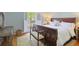 Cozy bedroom with wood floors, a large window, and traditional furnishings at 2567 Hyde Manor Nw Dr, Atlanta, GA 30327