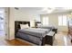 Comfortable bedroom with two beds, matching nightstands, and hardwood flooring at 2567 Hyde Manor Nw Dr, Atlanta, GA 30327