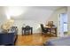 Home office area with two desks, hardwood floors, and ample natural light at 2567 Hyde Manor Nw Dr, Atlanta, GA 30327