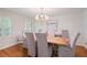 Dining room featuring hardwood floors and a modern chandelier at 2567 Hyde Manor Nw Dr, Atlanta, GA 30327