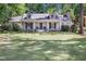 Inviting single-story home with a manicured lawn and a cozy, classic style at 2567 Hyde Manor Nw Dr, Atlanta, GA 30327