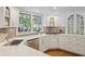 Bright kitchen with stainless steel appliances, white cabinets, and quartz countertops at 2567 Hyde Manor Nw Dr, Atlanta, GA 30327