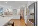 Spacious kitchen featuring stainless steel appliances, white cabinets, and hardwood floors at 2567 Hyde Manor Nw Dr, Atlanta, GA 30327