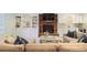 Cozy living room featuring a brick fireplace, built-in shelving, and comfortable seating at 2567 Hyde Manor Nw Dr, Atlanta, GA 30327